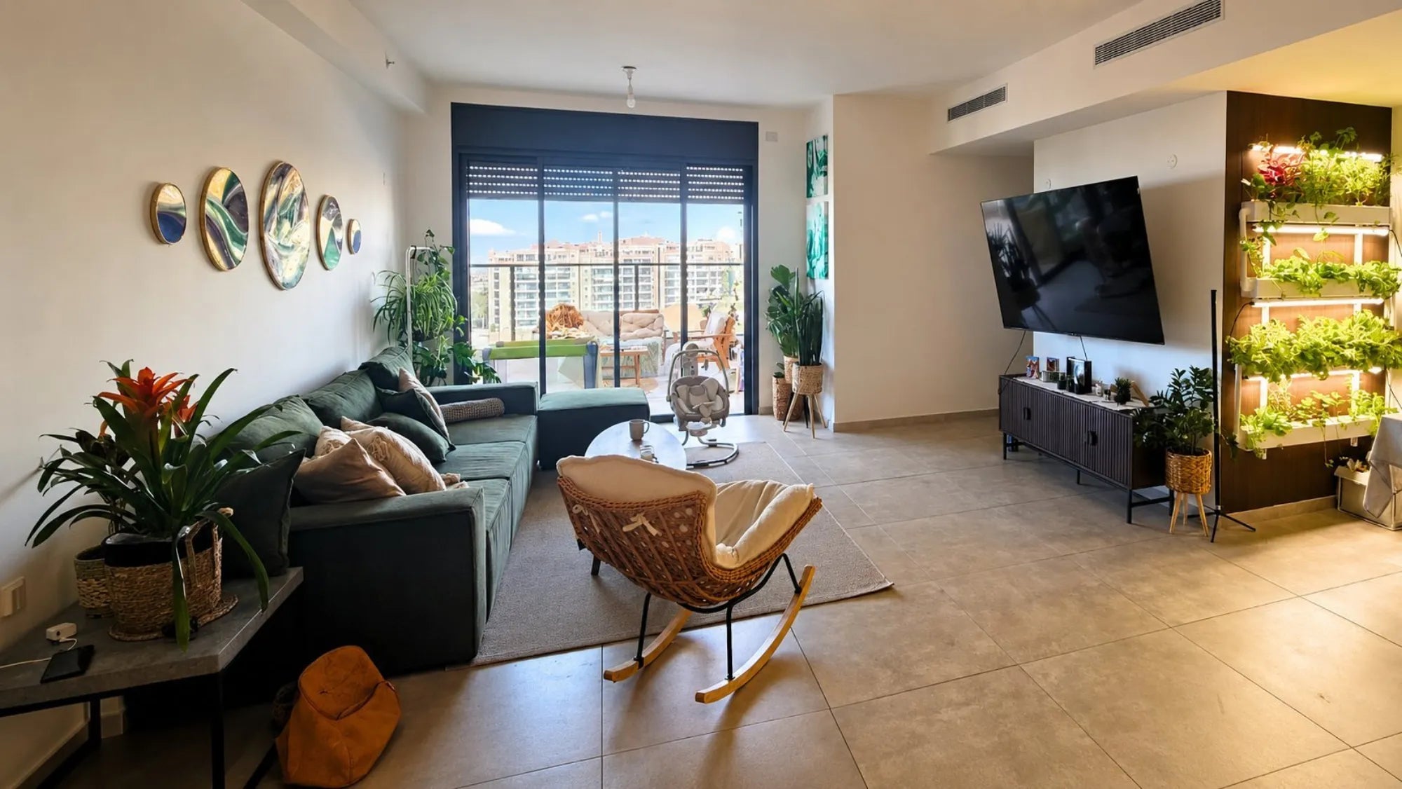 A living room with the Wally vertical garden integrated alongside everyday life